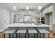Modern kitchen with gray cabinets, an island with seating, and pendant lighting at 9842 Quercus Ln, Huntersville, NC 28078