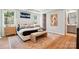 Spacious main bedroom with a large bed, bench, and modern decor at 9842 Quercus Ln, Huntersville, NC 28078