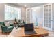 Comfortable office space with French doors, green chairs, and natural light at 9842 Quercus Ln, Huntersville, NC 28078