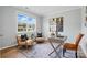 Bright home office with a large window offering natural light and neighborhood views at 9842 Quercus Ln, Huntersville, NC 28078