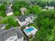Aerial view of backyard pool with lounge area, mature trees, and patio at 10304 Squires Way # 18, Cornelius, NC 28031