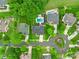 Overhead view of a neighborhood featuring mature landscaping and swimming pool at 10304 Squires Way # 18, Cornelius, NC 28031