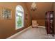 Finished attic space with carpet, natural light, and cozy seating at 10304 Squires Way # 18, Cornelius, NC 28031