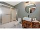 Modern bathroom with sleek fixtures, vessel sink, and glass-enclosed tub/shower at 10304 Squires Way # 18, Cornelius, NC 28031