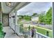 Inviting front porch with hanging plants and charming neighborhood views at 10304 Squires Way # 18, Cornelius, NC 28031