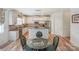 Charming kitchen showcases stainless steel appliances, white cabinets, and an island with seating at 10304 Squires Way # 18, Cornelius, NC 28031