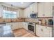 Beautiful kitchen features stainless steel appliances, granite countertops, and ample cabinet space at 10304 Squires Way # 18, Cornelius, NC 28031