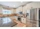 Well-lit kitchen featuring stainless steel appliances and granite countertops for a modern touch at 10304 Squires Way # 18, Cornelius, NC 28031