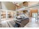 Spacious living room showcasing an open floor plan with staircase, ceiling fan, and hardwood floors at 10304 Squires Way # 18, Cornelius, NC 28031