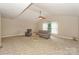 Bright living room featuring high ceilings, ceiling fan, and plush seating at 10304 Squires Way # 18, Cornelius, NC 28031