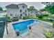 Beautiful in-ground pool with manicured landscaping in a spacious backyard at 10304 Squires Way # 18, Cornelius, NC 28031