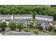 Townhomes from above showing well-manicured lawns and tree-lined streets in community at 10455 Alexander Martin Ave, Charlotte, NC 28277