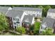 Aerial view of townhomes with well-maintained lawns and mature trees at 10455 Alexander Martin Ave, Charlotte, NC 28277