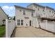 The backyard shows a patio and a white fence at 10455 Alexander Martin Ave, Charlotte, NC 28277