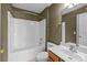 A full bathroom featuring a shower and tub, vanity, toilet, and modern fixtures at 10455 Alexander Martin Ave, Charlotte, NC 28277