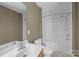 Bathroom with a single sink vanity, a mirror, and a shower-tub combination at 10455 Alexander Martin Ave, Charlotte, NC 28277