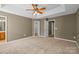 Large bedroom with neutral carpet and an en-suite bathroom at 10455 Alexander Martin Ave, Charlotte, NC 28277