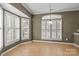 Sunny dining area with tile floors and bay window offering ample natural light at 10455 Alexander Martin Ave, Charlotte, NC 28277