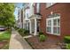 The exterior elevation shows a brick-front home with landscaping at 10455 Alexander Martin Ave, Charlotte, NC 28277