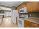 Functional kitchen with classic appliances, ample counter space, and view into the living area at 10455 Alexander Martin Ave, Charlotte, NC 28277