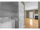 Functional laundry room with a washer and dryer, as well as shelving for storage at 10455 Alexander Martin Ave, Charlotte, NC 28277