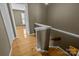 A stairway with wooden floors and white trim at 10455 Alexander Martin Ave, Charlotte, NC 28277