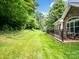 Large, green backyard with mature trees provides an abundance of space and privacy at 10875 Casetta Dr, Matthews, NC 28105