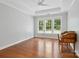 Bright bedroom with large windows, crown moulding and hardwood floors at 10875 Casetta Dr, Matthews, NC 28105