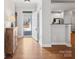 Inviting foyer with hardwood floors and views of the kitchen, showcases a bright and open layout at 10875 Casetta Dr, Matthews, NC 28105