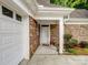 Welcoming front entrance with a white door and stone facade offers curb appeal at 10875 Casetta Dr, Matthews, NC 28105