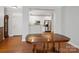 Bright kitchen featuring white cabinets, stainless steel appliances, and hardwood flooring at 10875 Casetta Dr, Matthews, NC 28105