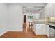 Open-concept kitchen featuring granite countertops and hardwood floors at 10875 Casetta Dr, Matthews, NC 28105