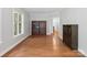 Comfortable living room with hardwood floors and natural lighting at 10875 Casetta Dr, Matthews, NC 28105