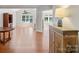 Spacious living room with hardwood floors, fireplace, and large window offering natural light at 10875 Casetta Dr, Matthews, NC 28105