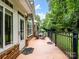 Relaxing outdoor space with patio seating and black metal railing offers style and safety at 10875 Casetta Dr, Matthews, NC 28105