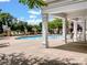 Relaxing poolside view with lounge chairs, umbrellas, and a clear, inviting swimming pool at 10875 Casetta Dr, Matthews, NC 28105
