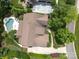 Aerial view of luxury home with in ground pool, three car garage, and mature landscaping at 1103 Mapesbury Ln, Waxhaw, NC 28173