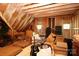 Unfinished attic space with exposed beams and unfinished walls containing stored items at 1103 Mapesbury Ln, Waxhaw, NC 28173