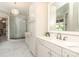 Elegant bathroom with a marble floor, large vanity, and glass-enclosed shower at 1103 Mapesbury Ln, Waxhaw, NC 28173
