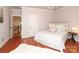 Cozy bedroom featuring hardwood floors and a view of the property grounds at 1103 Mapesbury Ln, Waxhaw, NC 28173