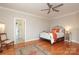 Cozy bedroom with hardwood floors, a large rug and a decorative wrought iron bed at 1103 Mapesbury Ln, Waxhaw, NC 28173