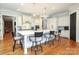Spacious kitchen with a large island, barstool seating, and modern appliances at 1103 Mapesbury Ln, Waxhaw, NC 28173