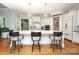 Bright kitchen featuring an island, barstool seating, and stainless steel appliances at 1103 Mapesbury Ln, Waxhaw, NC 28173