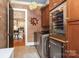 Modern laundry room featuring ample storage and a stainless steel wine cooler at 1103 Mapesbury Ln, Waxhaw, NC 28173