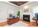 Elegant office space with hardwood floors, fireplace, and ample natural light at 1103 Mapesbury Ln, Waxhaw, NC 28173
