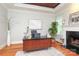 Elegant office space with hardwood floors, fireplace, and ample natural light at 1103 Mapesbury Ln, Waxhaw, NC 28173