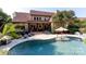 Back exterior of home featuring a backyard pool with a seating area and lounge chairs on the patio at 1103 Mapesbury Ln, Waxhaw, NC 28173