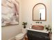 Stylish powder room with a vessel sink, decorative mirror, and modern decor at 1103 Mapesbury Ln, Waxhaw, NC 28173