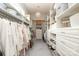 Spacious walk-in closet with custom shelves and storage at 1103 Mapesbury Ln, Waxhaw, NC 28173
