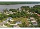 Gorgeous aerial view of a neighborhood nestled by a lake, showcasing beautiful homes and lush landscapes at 11225 Island View Ln, Lancaster, SC 29720